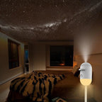Aurora Star Projector set up on a nightstand next to a bed